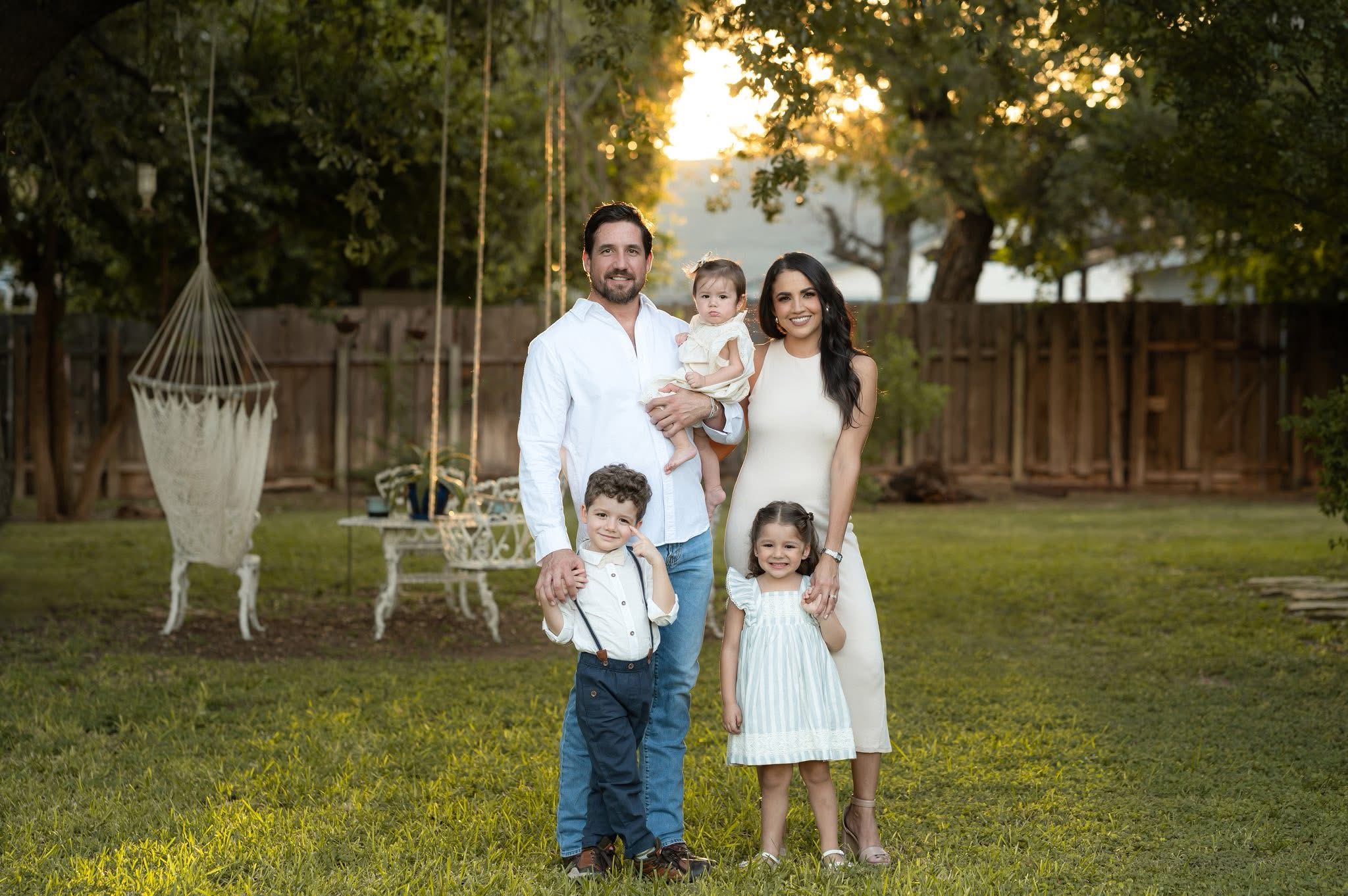 Frank Flores with his wife and three kids in the backyard